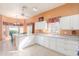 Spacious kitchen with ample cabinetry, breakfast bar, and sunny eat-in area at 11544 W Javelina Ct, Surprise, AZ 85378