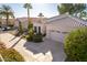 Single-story home with a two-car garage and landscaped front yard at 11544 W Javelina Ct, Surprise, AZ 85378