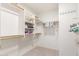 Large walk-in closet with ample shelving and hanging space at 11544 W Javelina Ct, Surprise, AZ 85378