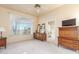 Spacious Primary bedroom with large window, dresser and ensuite bathroom at 11544 W Javelina Ct, Surprise, AZ 85378