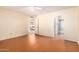 Bedroom with wood floors, ceiling fan, and access to bathroom at 7950 E Keats Ave # 130, Mesa, AZ 85209