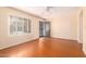 Living area showcasing wood-look floors and window shutters at 7950 E Keats Ave # 130, Mesa, AZ 85209