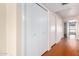 Clean hallway with wood-look floors and double door closet at 7950 E Keats Ave # 130, Mesa, AZ 85209