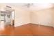 Spacious bedroom with ceiling fan, wood-look flooring and access to other rooms at 7950 E Keats Ave # 130, Mesa, AZ 85209