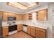Kitchen boasts wood cabinets, recessed lighting, and appliances at 7950 E Keats Ave # 130, Mesa, AZ 85209