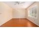 Spacious bedroom with wood-look floors and window shutters at 7950 E Keats Ave # 130, Mesa, AZ 85209