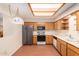 Kitchen with wood cabinets, recessed lighting, and appliances at 7950 E Keats Ave # 130, Mesa, AZ 85209