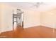 Bright bedroom with wood-look floors and access to hallway at 7950 E Keats Ave # 130, Mesa, AZ 85209