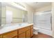 Clean bathroom with shower/tub combo and wood vanity at 7950 E Keats Ave # 130, Mesa, AZ 85209