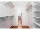 Walk-in closet with shelves and hanging rods at 7950 E Keats Ave # 130, Mesa, AZ 85209