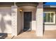 Front door entrance with security door and brick exterior at 7950 E Keats Ave # 130, Mesa, AZ 85209