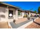 Front entrance of the home with a walkway, landscaping and part of the adjacent unit at 7950 E Keats Ave # 130, Mesa, AZ 85209