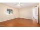 Bright bedroom with wood-look floors and ceiling fan at 7950 E Keats Ave # 130, Mesa, AZ 85209