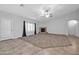 Bright living room featuring a fireplace and carpet at 28308 N 157Th Pl, Scottsdale, AZ 85262