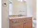 Bathroom with granite countertop and wood cabinets at 18029 W San Miguel Ave, Litchfield Park, AZ 85340