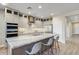 Modern kitchen island with granite countertop and seating for four at 18336 E Spring Valley Ct, Rio Verde, AZ 85263