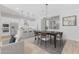 Bright dining area with modern table and chairs, adjacent to the kitchen at 23117 E Reins Rd, Queen Creek, AZ 85142