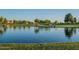 Calm lake view with reflections of surrounding landscape at 45680 W Barbara Ln, Maricopa, AZ 85139