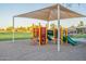 playground with shaded area and play equipment at 45680 W Barbara Ln, Maricopa, AZ 85139