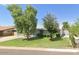 Ranch style home with mature landscaping and a detached garage at 4936 E Coronado Rd, Phoenix, AZ 85008