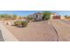 Landscaped yard with desert plants and rock features at 2237 N Calle Largo --, Mesa, AZ 85207