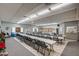 Bright community room featuring long tables and chairs at 3270 S Goldfield Rd # 217, Apache Junction, AZ 85119