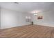 Spacious dining area with wood-look floors and neutral walls at 45680 W Barbara Ln, Maricopa, AZ 85139