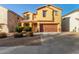 Two-story house with a brown door and attached garage at 45680 W Barbara Ln, Maricopa, AZ 85139