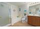 Bathroom features a tub, shower, and wood vanity at 45680 W Barbara Ln, Maricopa, AZ 85139