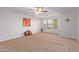 Bright bedroom with carpet, ceiling fan, and art at 45680 W Barbara Ln, Maricopa, AZ 85139