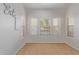 Bright breakfast nook with large windows and tile floor at 45680 W Barbara Ln, Maricopa, AZ 85139