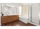 Bathroom featuring a large vanity, soaking tub, and shower at 6231 W Shannon St, Chandler, AZ 85226