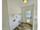 Bright laundry room with built-in shelving at 2213 E Janice Way, Phoenix, AZ 85022