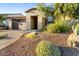 Single story home with a brown garage door and landscaped yard at 18036 E Curva De Plata --, Rio Verde, AZ 85263