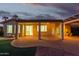 Evening view of covered patio with lights at 16513 W Windsor Ave, Goodyear, AZ 85395