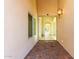 Elegant entryway with tiled flooring and a view through to the living areas at 16513 W Windsor Ave, Goodyear, AZ 85395