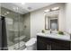 Stylish bathroom with gray tile, a glass shower, and floating vanity at 160 N Shore Ln, Gilbert, AZ 85233