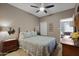 Bedroom with a queen bed, nightstand and ceiling fan at 145 N 74Th St # 241, Mesa, AZ 85207