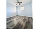 Spacious bedroom featuring light walls and wood-look floors at 4936 E Coronado Rd, Phoenix, AZ 85008