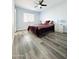 Main bedroom with large bed and ceiling fan at 4936 E Coronado Rd, Phoenix, AZ 85008