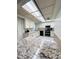 Galley kitchen with granite countertops, white cabinets, and stainless steel appliances at 4936 E Coronado Rd, Phoenix, AZ 85008