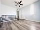 Bright bedroom with ceiling fan and wood-look floors at 4936 E Coronado Rd, Phoenix, AZ 85008