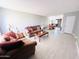 Bright living room with tile flooring, neutral walls, and ample natural light at 4936 E Coronado Rd, Phoenix, AZ 85008