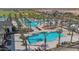 Large resort-style pool with palm trees and lounge chairs at 17209 W Wildwood St, Surprise, AZ 85388