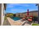 Private backyard pool with lounge chairs and patio umbrella at 17209 W Wildwood St, Surprise, AZ 85388