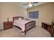 Cozy bedroom with carpeted floor, ceiling fan, and wood furniture at 846 N Pueblo Dr # 111, Casa Grande, AZ 85122
