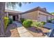 Attractive desert landscaping enhances the curb appeal of this two-car garage home at 846 N Pueblo Dr # 111, Casa Grande, AZ 85122