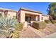 Rear exterior view showing patio, landscaping, and walkway at 846 N Pueblo Dr # 111, Casa Grande, AZ 85122