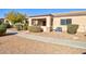 Side exterior view of home with landscaping and walkway at 846 N Pueblo Dr # 111, Casa Grande, AZ 85122