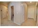 Bright hallway with tile flooring, linen closet and access to other rooms at 846 N Pueblo Dr # 111, Casa Grande, AZ 85122
